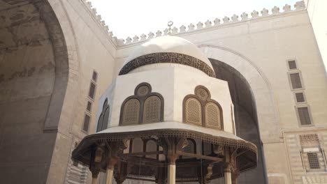 tilt-down-shot-of-a-fountain-at-sultan-hassan-mosque-in-cairo