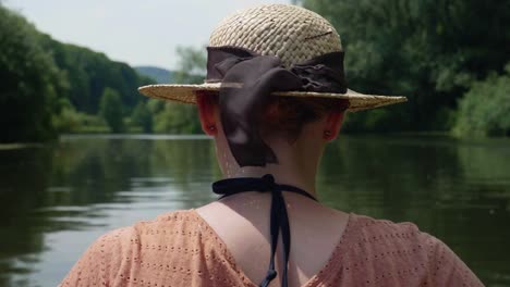 Young-girl-canoeing-on-a-beautiful-lake-on-sunny-water