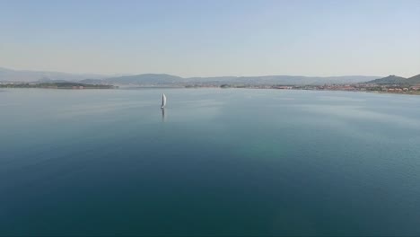 a-single-sailboat-in-the-middle-of-the-sea