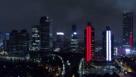 Rascacielos-en-Estambul-en-la-noche:-vista-aérea-Drone-de-edificios-iluminados