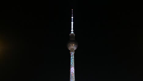 Video-projection-on-illuminated-landmark-(-TV-Tower-/-Fernsehturm)-at-night-during-Berlin-leuchtet-a.k.a.-Festival-of-Lights-in-Berlin,-Germany