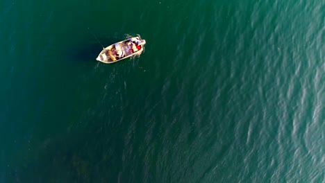 Tourists-fishing-on-a-boat-in-river-4k