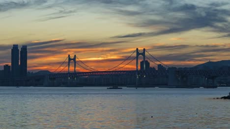 Timelapse-of-Gwangan-Bridge-and-Haeundae-at-Sunset,-Busan-City,-South-Korea.Timelapse-4k