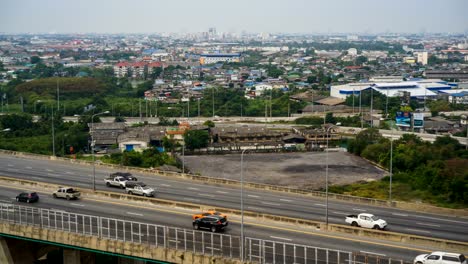 BANGKOK,-THAILAND.-4K-Video-Timelapse-of-driving-&-cars-racing.-Aerial-View-of-freeway-busy-city-rush-hour.