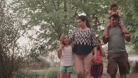 A-family-walking-together-under-trees