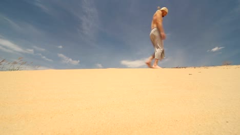 A-man-walks-through-the-desert