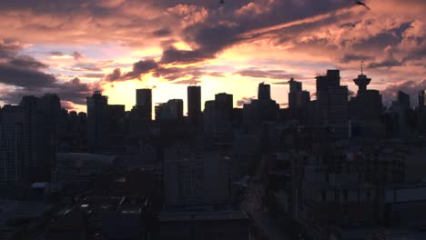 Aerial-View-flying-over-downtown-Vancouver-at-sunset