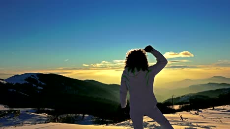 Victory-Pose-by-Woman-on-Top-of-Mountain-Sunset-Lifting-Hands-at-the-Sun.-Victory,-Success,-Business-Background-Concept.-UHD-steadycam-stock-video