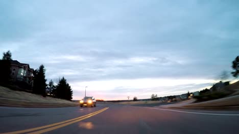 Driving-on-suburban-road-early-in-the-morning.