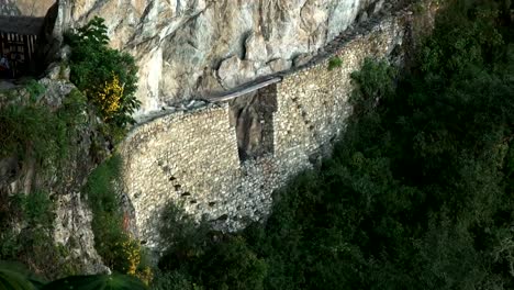 tilt-down-shot-of-the-incan-bridge-at-machu-picchu