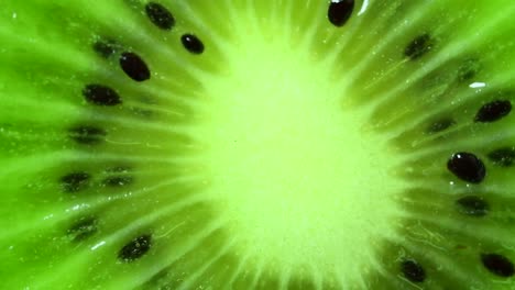 Rotating-kiwi-slice,-macro