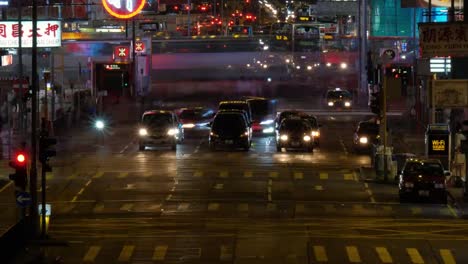 Time-lapse-of-busy-street-with-traffic-and-pedestrians-of-Mong-Kok-at-night-in-Hong-Kong.