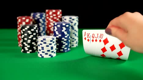 Poker-player-discreetly-holding-best-combination-of-cards,-royal-flush,-strategy