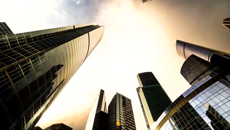 bottom-up-view-of-rotating-skyscrapers-and-flying-clouds,time-lapse,-hyper-lapse