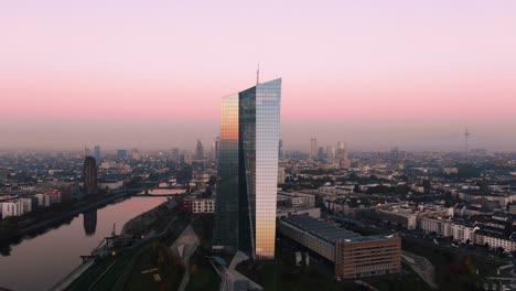 Frankfurt-ECB-Skyline-Aerial-Shot-at-early-sunrise-reflecting-sun