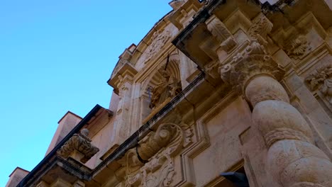 Beautiful-ancient-church-with-twisted-columns,-a-ornate-decorated-facade