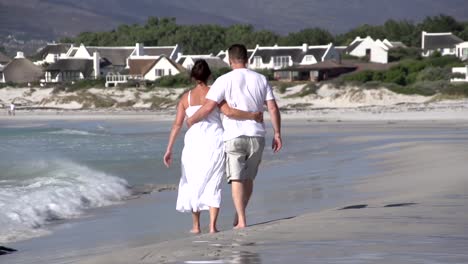 Romantic-couple-walking-along-beach,-Cape-Town,-South-Africa