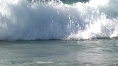 Young-boy-playing-and-body-surfing-in-the-waves,-Cape-Town,South-Africa