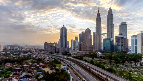 Dramatic-sunrise-at-Kuala-Lumpur-city.-Moving-and-changing-color-clouds.-Aerial-view.