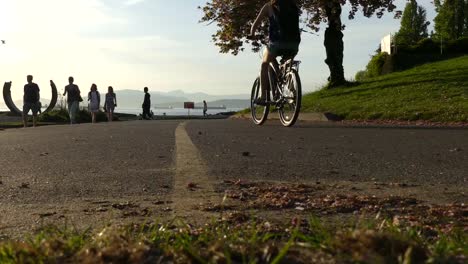 Girls-riding-bicycle-Vancouver-ocean-shore