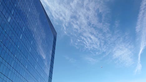 The-Airplane-is-flying-close-to-skyscraper