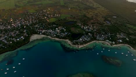 Aerial-view-of-Mauritius-town,-bay-and-farmlands