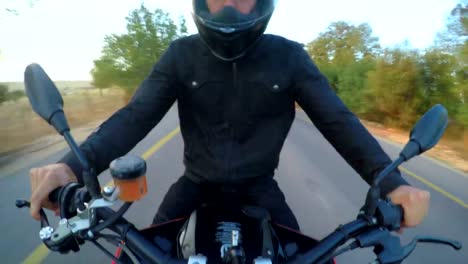 POV-footage-of-man-riding-a-red-sports-motorcycle-on-a-curved-road