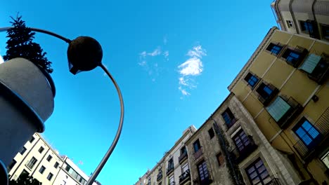 Rotating-view-to-sky-and-Barcelona-traditional-architecture-buildings