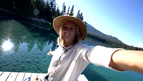 Woman-selfie-pov-by-alpine-lake-in-the-Canadians-rockies