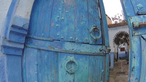 Large-old-wooden-door-located-in-the-town-of-Chefchaouen-in-Morocco