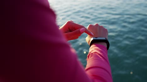 Hispanic-Caucasian-female-wrist-with-heart-rate-monitor