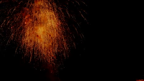 A-crowd-of-people-watch-colorful-fireworks-and-celebrate.