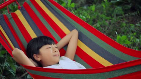 Slow-motion,-Little-girl-is-sleeping-in-hammock