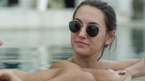 Loving-Couple-Talking-in-Swimming-Pool