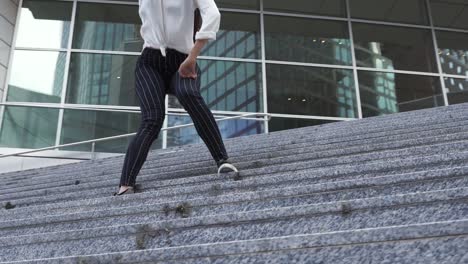 Young-Woman-Dancing-on-the-Steps-of-a-Corporate-Building-2