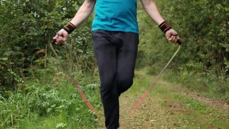 Close-up-shot-of-senior-man-skipping-fancily-with-a-jump-rope