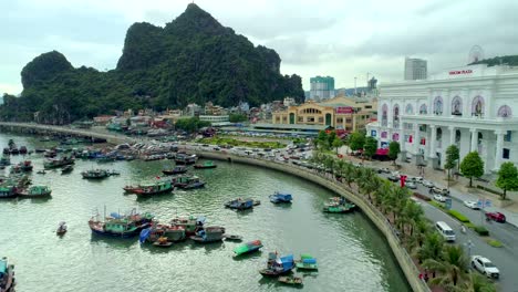 4k-Aerial-view-over-city-and-park-with-Bai-Tho-karst-mountain-Ha-long-bay.-Halong-City.