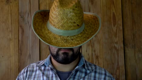 A-man-in-a-straw-hat-sleeps