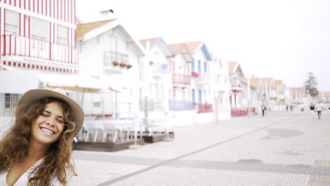 Young-woman-pulling-boyfriend-to-striped-houses