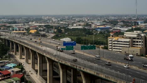 BANGKOK,-THAILAND.-4K-Video-Timelapse-of-driving-&-cars-racing.-Aerial-View-of-freeway-busy-city-rush-hour.