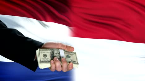 Netherlands-and-Indonesia-officials-exchanging-tank-for-money,-flag-background