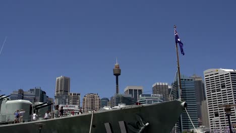 Front-of-a-big-marine-ship-with-the-Australian-flag-with-the-Sydney-tower-and-skyline-at-the-background