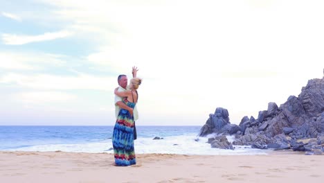 An-older-couple-dancing-on-the-beach