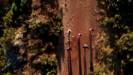 Multi-ethnic-group-of-athletes-running-on-a-footpath