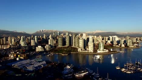 High-aerial-of-downtown-Vancouver-mountain-background