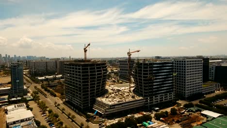 Building-under-construction-with-cranes-in-the-city.-Philippines,-Manila,-Makati