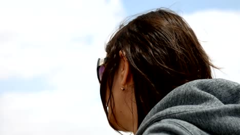 Longhair-woman-smiling-and-laughing-outdoors