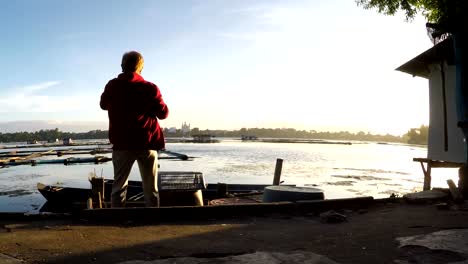 Mature-woman-Dance-Exercise-at-lake-shore.-silhouettes