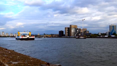 Ferry-and-sailing-ships-on-river-Thames,-London