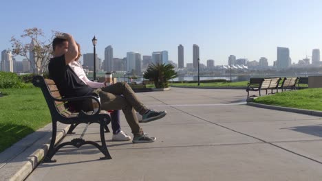 Couple-relaxing-on-San-Diego-City-bench